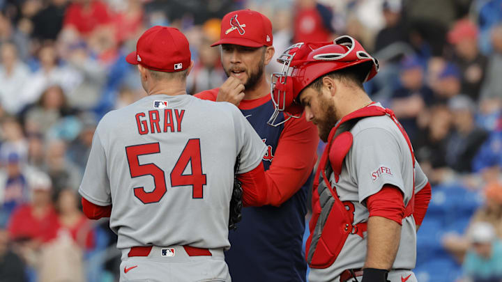 Mar 10, 2025; Port St. Lucie, Florida, USA;  St. Louis Cardinals pitching coach Dusty Blake talks with pitcher Sonny Gray (54) and catcher Pedro Pagés (43) during the second  inning against the New York Mets at Clover Park. Mandatory Credit: Reinhold Matay-Imagn Images