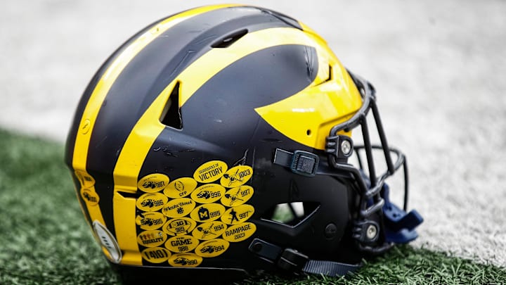 A Michigan football helmet on the field during warmup at the spring game at Michigan Stadium A Michigan football helmet on the field during warmup at the spring game at Michigan Stadium