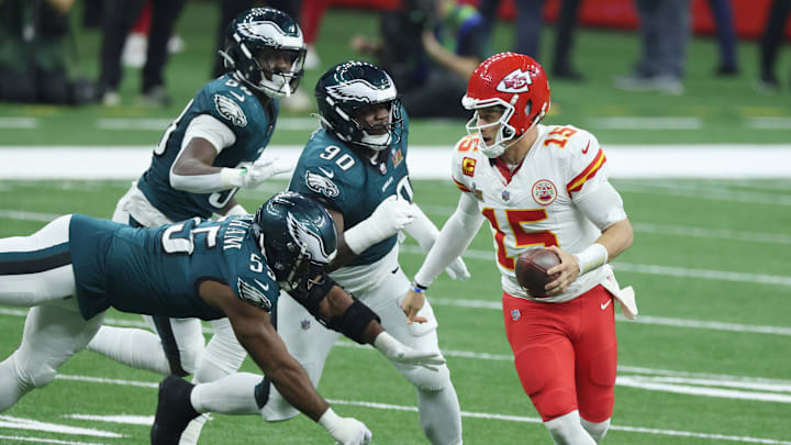 Feb 9, 2025; New Orleans, LA, USA;  Kansas City Chiefs quarterback Patrick Mahomes (15) scrambles away from Philadelphia Eagles defensive end Brandon Graham (55) in the third quarter in Super Bowl LIX at Ceasars Superdome. Mandatory Credit: Stephen Lew-Imagn Images