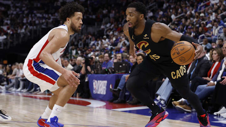 May 5, 2026; Detroit, Michigan, USA; Cleveland Cavaliers guard Donovan Mitchell (45) dribbles defended by Detroit Pistons guard Cade Cunningham (2) in the first half during game one of the second round of the 2026 NBA Playoffs at Little Caesars Arena. Mandatory Credit: Rick Osentoski-Imagn Images