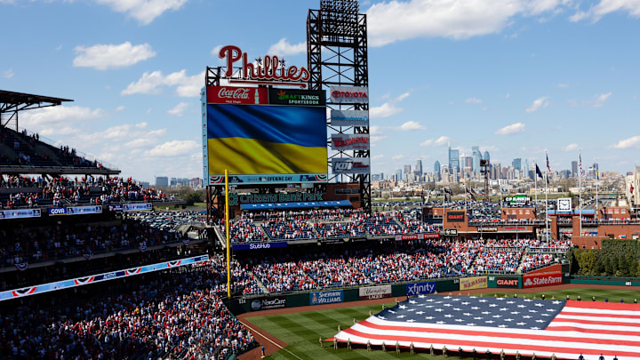 Apr 8, 2022; Philadelphia, Pennsylvania, USA; A Ukrainian flag is shown on the large scoreboard before the anthem on an opening day game between the Philadelphia Phillies and the Oakland Athletics at Citizens Bank Park. Mandatory Credit: Bill Streicher-Imagn Images