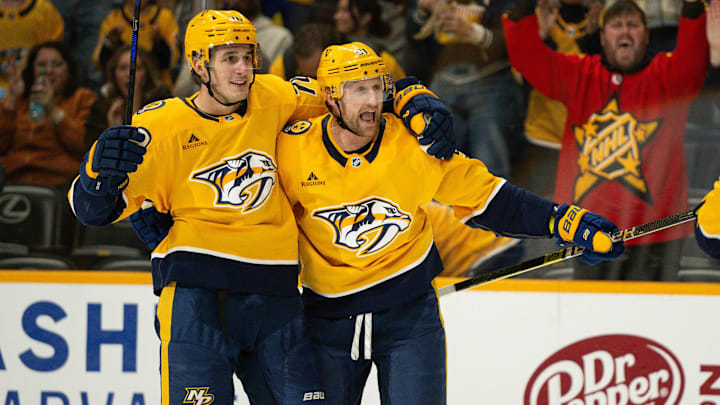 Nov 23, 2024; Nashville, Tennessee, USA;  Nashville Predators center Steven Stamkos (91) celebrates his goal with defenseman Brady Skjei (76) against the Winnipeg Jets during the third period at Bridgestone Arena. Mandatory Credit: Steve Roberts-Imagn Images