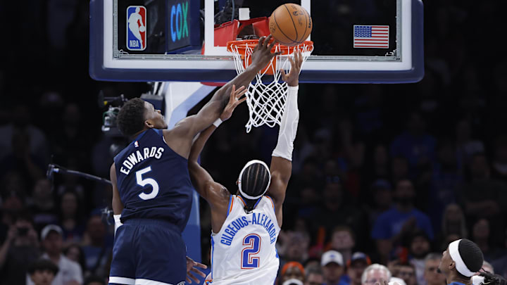 Feb 24, 2025; Oklahoma City, Oklahoma, USA; Minnesota Timberwolves guard Anthony Edwards (5) blocks a shot by Oklahoma City Thunder guard Shai Gilgeous-Alexander (2) during the second half at Paycom Center.