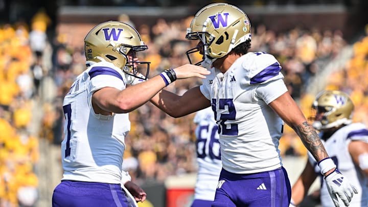 Oct 12, 2024; Iowa City, Iowa, USA; Washington Huskies quarterback Will Rogers (7) and wide receiver Denzel Boston (12) react after connecting on a touchdown pass during the second quarter against the Iowa Hawkeyes at Kinnick Stadium. Mandatory Credit: Jeffrey Becker-Imagn Images