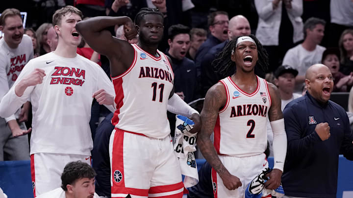 Mar 23, 2024; Salt Lake City, UT, USA; Arizona Wildcats center Oumar Ballo (11) and guard Caleb Love
