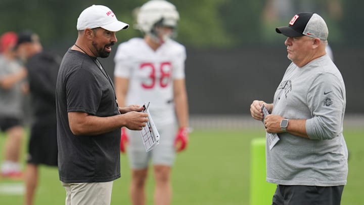 Ohio State Buckeyes head coach Ryan Day talks with offensive coordinator Chip Kelly during a fall camp practice last August at the Woody Hayes Athletic Center. Day and Kelly both attended Manchester Central High School, and Day was a quarterback at UNH when Kelly was part of the coaching staff.
