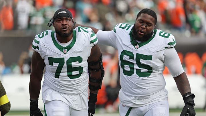 Oct 26, 2025; Cincinnati, Ohio, USA; New York Jets guard John Simpson (76) and guard Xavier Newman (65) walks off the court after winning the game against the Cincinnati Bengals at Paycor Stadium. Mandatory Credit: Joseph Maiorana-Imagn Images Oct 26, 2025; Cincinnati, Ohio, USA; New York Jets guard John Simpson (76) and guard Xavier Newman (65) walks off the court after winning the game against the Cincinnati Bengals at Paycor Stadium. Mandatory Credit: Joseph Maiorana-Imagn Images