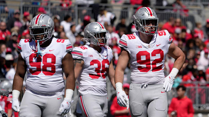 Ohio State Buckeyes defensive tackle Kayden McDonald (98), linebacker Gabe Powers (36) and defensive end Caden Curry (92) compete during a spring football game on April 13, 2024.