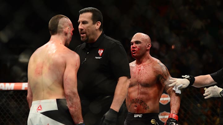 Jul 11, 2015; Las Vegas, NV, USA; Robbie Lawler (red gloves) and Rory MacDonald (blue gloves) fight