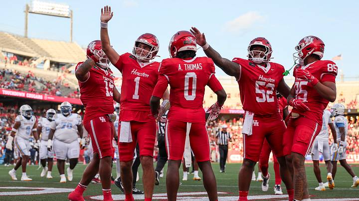 Sep 12, 2026; Houston, Texas, USA; Houston Cougars wide receiver Amare Thomas (0) celebrates and quarterback Conner Weigman (1) waves to the crowd after a touchdown during the first quarter against the Southern University Jaguars at TDECU Stadium. Mandatory Credit: Troy Taormina-Imagn Images Sep 12, 2026; Houston, Texas, USA; Houston Cougars wide receiver Amare Thomas (0) celebrates and quarterback Conner Weigman (1) waves to the crowd after a touchdown during the first quarter against the Southern University Jaguars at TDECU Stadium. Mandatory Credit: Troy Taormina-Imagn Images