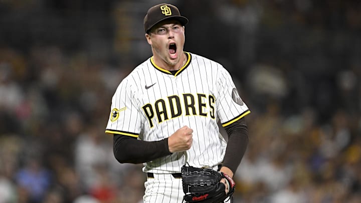 Sep 9, 2025; San Diego, California, USA; San Diego Padres relief pitcher Mason Miller (22) celebrates after striking out a batter during the eighth inning against the Cincinnati Reds at Petco Park. Mandatory Credit: Denis Poroy-Imagn Images