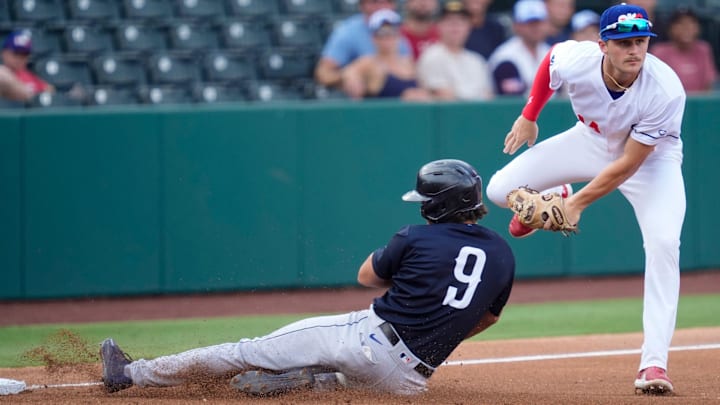 Oklahoma City Baseball Club infielder Alex Freeland (14) tags out Round Rock Express outfielder Dustin Harris (9) at third basebduring a baseball game between the Oklahoma City Baseball Club and the Round Rock Express at the Chickasaw Bricktown Ballpark in Oklahoma City, Wednesday, Aug. 7, 2024.