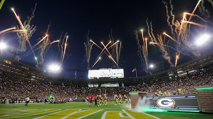 Fireworks are fired off as the Green Bay Packers run out of the tunnel before their game against the Detroit Lions. Fireworks are fired off as the Green Bay Packers run out of the tunnel before their game against the Detroit Lions.