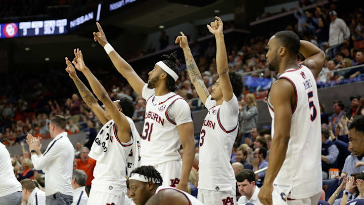Auburn basketball players enjoy what the Jungle does before every home game at the Neville Arena