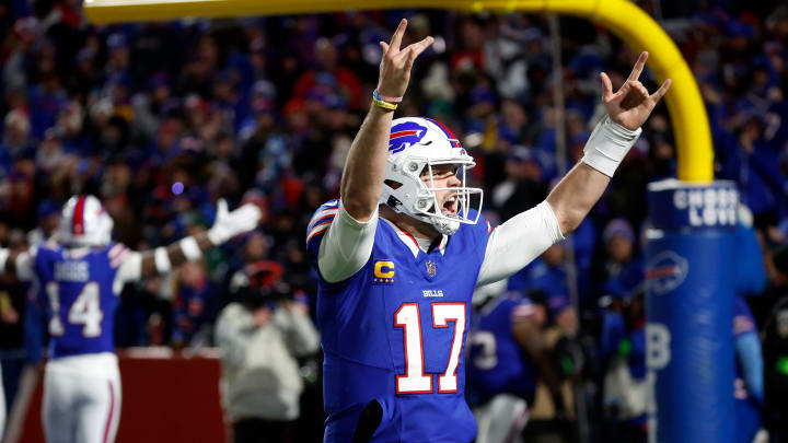 Buffalo Bills quarterback Josh Allen (17) celebrates with fans after his 81 yard touchdown pass to Buffalo Bills wide receiver Khalil Shakir (10).