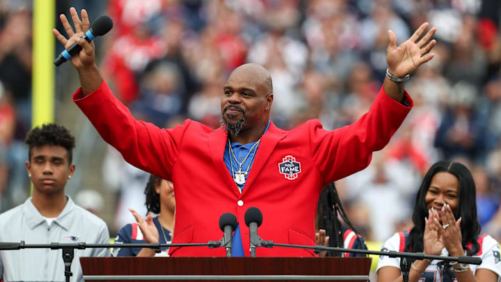 Sep 25, 2022; Foxborough, Massachusetts, USA; New England Patriots Hall of Famer Vince Wilfork reacts during a halftime celebration at Gillette Stadium during a game against the Baltimore Ravens. Mandatory Credit: Paul Rutherford-Imagn Images