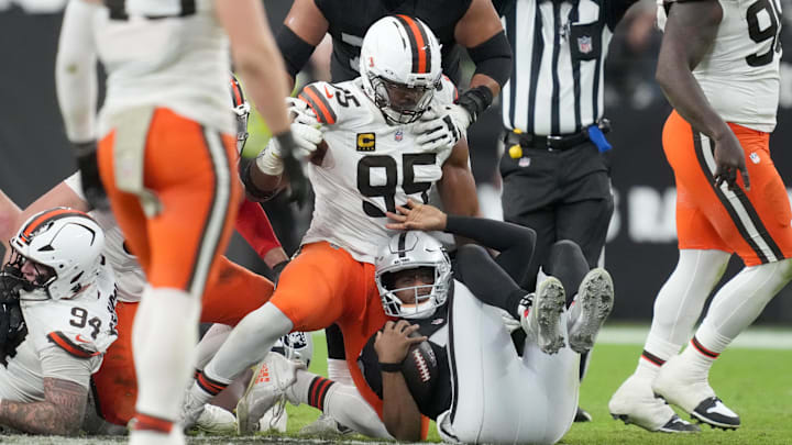 Nov 23, 2025; Paradise, Nevada, USA; Cleveland Browns defensive end Myles Garrett (95) sacks Las Vegas Raiders quarterback Geno Smith (7) in the second half at Allegiant Stadium. Mandatory Credit: Kirby Lee-Imagn Images