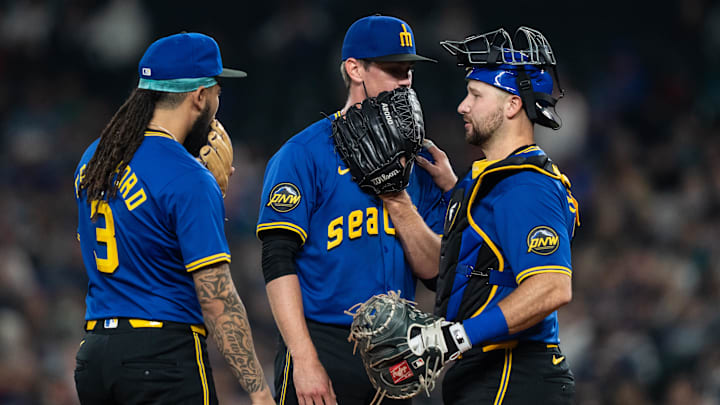 Seattle Mariners catcher Cal Raleigh (right) speaks to his teammates during a game against the Texas Rangers on Friday at T-Mobile Park. Seattle Mariners catcher Cal Raleigh (right) speaks to his teammates during a game against the Texas Rangers on Friday at T-Mobile Park.