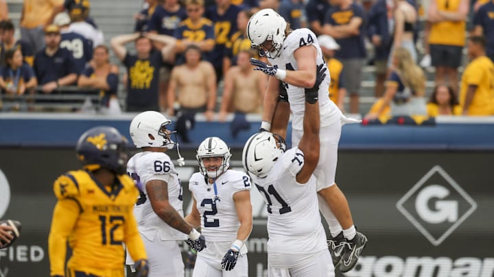 Penn State Nittany Lions tight end Tyler Warren (44) celebrates with teammates after catching a touchdown pass against the West Virginia Mountaineers. Penn State Nittany Lions tight end Tyler Warren (44) celebrates with teammates after catching a touchdown pass against the West Virginia Mountaineers.