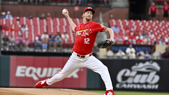 Aug 7, 2024; St. Louis, Missouri, USA;  St. Louis Cardinals starting pitcher Erick Fedde (12) pitches against the Tampa Bay Rays during the first inning at Busch Stadium. Mandatory Credit: Jeff Curry-Imagn Images