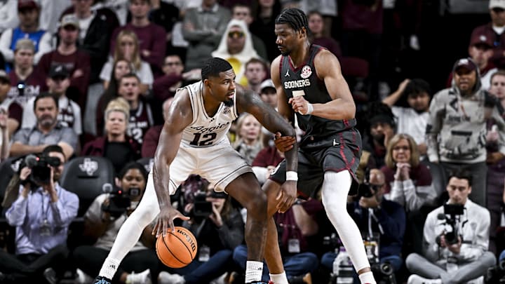 Texas A&M Aggies forward Rashaun Agee (12) controls the ball as Oklahoma Sooners forward Mohamed Wague (5) defends during the second half at Reed Arena. Mandatory Credit: Maria Lysaker-Imagn Images 