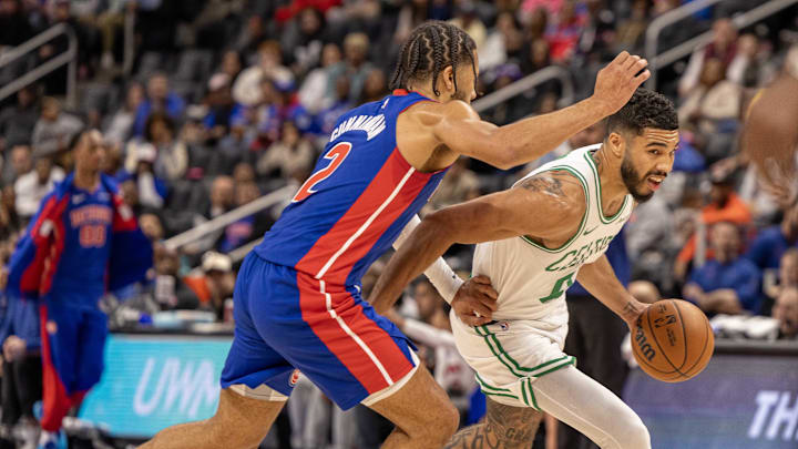 Oct 26, 2024; Detroit, Michigan, USA; Boston Celtics forward Jayson Tatum (0) drives to the basket against Detroit Pistons guard Cade Cunningham (2) during the in the first half at Little Caesars Arena. Mandatory Credit: David Reginek-Imagn Images Oct 26, 2024; Detroit, Michigan, USA; Boston Celtics forward Jayson Tatum (0) drives to the basket against Detroit Pistons guard Cade Cunningham (2) during the in the first half at Little Caesars Arena. Mandatory Credit: David Reginek-Imagn Images