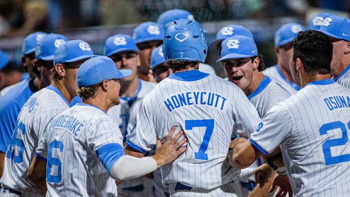 May 24, 2024; Charlotte, NC, USA; North Carolina Tar Heels outfielder Vance Honeycutt (7) celebrates after scoring in the eighth inning against the Wake Forest during the ACC Baseball Tournament at Truist Field. Mandatory Credit: Scott Kinser-USA TODAY Sports