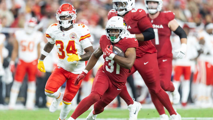 Aug 9, 2025; Glendale, Arizona, USA; Arizona Cardinals running back Emari Demercado (31) runs for a touchdown against the Kansas City Chiefs during a preseason NFL game at State Farm Stadium. Mandatory Credit: Mark J. Rebilas-Imagn Images