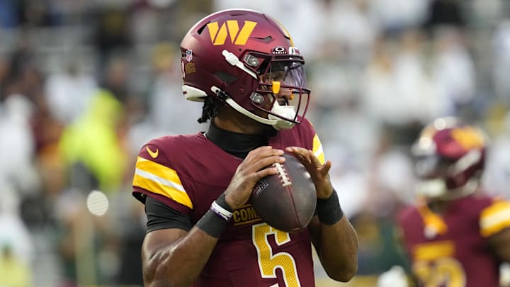 Sep 11, 2025; Green Bay, Wisconsin, USA; Washington Commanders quarterback Jayden Daniels (5) warms up before a game against the Green Bay Packers at Lambeau Field. Mandatory Credit: Jeff Hanisch-Imagn Images Sep 11, 2025; Green Bay, Wisconsin, USA; Washington Commanders quarterback Jayden Daniels (5) warms up before a game against the Green Bay Packers at Lambeau Field. Mandatory Credit: Jeff Hanisch-Imagn Images