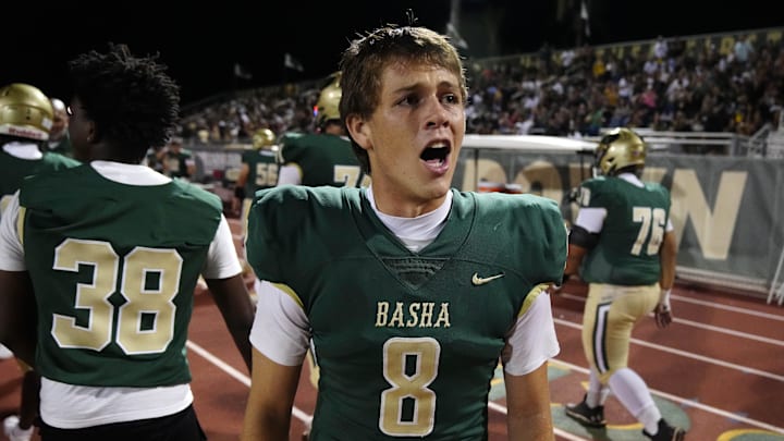 Basha quarterback Brodie Vehrs (8) yells to his teammates on the sidelines during a game at Hamilton High School in Chandler on Aug. 29, 2024.