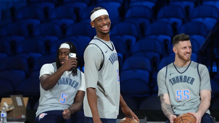 Dec 12, 2025; Las Vegas, NV, USA; Oklahoma City Thunder guard Luguentz Dort (5), guard Shai Gilgeous-Alexander (2) and center Isaiah Hartenstein (55) react during practice prior to the Emirates Cup semifinals at T-Mobile Arena. Mandatory Credit: Kirby Lee-Imagn Images Dec 12, 2025; Las Vegas, NV, USA; Oklahoma City Thunder guard Luguentz Dort (5), guard Shai Gilgeous-Alexander (2) and center Isaiah Hartenstein (55) react during practice prior to the Emirates Cup semifinals at T-Mobile Arena. Mandatory Credit: Kirby Lee-Imagn Images