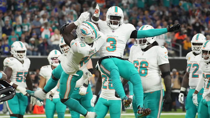 Miami Dolphins wide receiver Tyreek Hill (10) celebrates with wide receiver Odell Beckham Jr. (3) after scoring on a 1-yard touchdown reception against the Los Angeles Rams in the second half at SoFi Stadium.