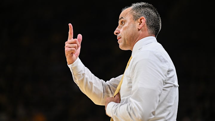 Iowa Hawkeyes head coach Ben McCollum