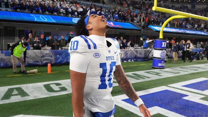 Dec 6, 2025; Charlotte, NC, USA; Duke Blue Devils quarterback Darian Mensah (10) reacts after winning the  ACC Championship game at Bank of America Stadium. Mandatory Credit: Bob Donnan-Imagn Images