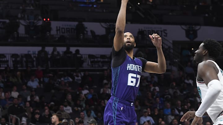 Apr 8, 2025; Charlotte, North Carolina, USA;  Charlotte Hornets center center Taj Gibson (67) drives in during the first half against the Memphis Grizzlies at the Spectrum Center. Mandatory Credit: Sam Sharpe-Imagn Images