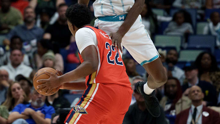 Nov 4, 2025; New Orleans, Louisiana, USA; Charlotte Hornets forward Moussa Diabate (14) fouls New Orleans Pelicans center Derik Queen (22) during the second half at Smoothie King Center. Mandatory Credit: Matthew Hinton-Imagn Images