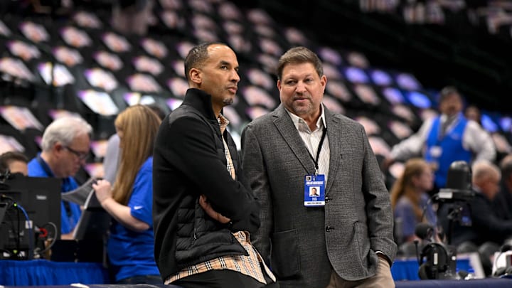 Dallas Mavericks general manager Nico Harrison (left) speaks with reporter Marc Stein (right) before the game between the Dallas Mavericks and the Phoenix Suns at the American Airlines Center.