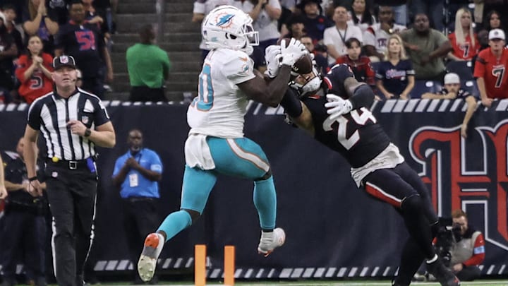 Houston Texans cornerback Derek Stingley Jr. (24) intercepts the ball against Miami Dolphins wide receiver Tyreek Hill (10) in the fourth quarter at NRG Stadium.