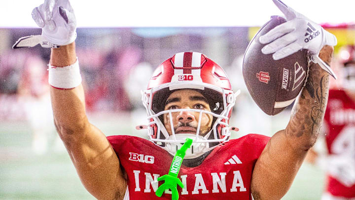 Indiana's Elijah Sarratt (13) celebrates a touchdown during the Indiana versus Purdue football game at Memorial Stadium on Saturday, Nov. 30, 2024.