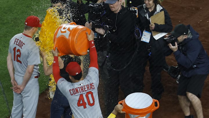 May 9, 2025; Washington, District of Columbia, USA; St. Louis Cardinals pitcher Erick Fedde (12) is doused with Gatorade by Cardinals first base Willson Contreras (40) after throwing a complete game shutout against the Washington Nationals at Nationals Park. Mandatory Credit: Geoff Burke-Imagn Images