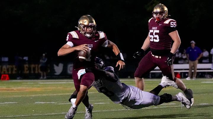 Pickerington Central's Moses Ifakorede (8) tackles Bishop Watterson's Dash Hoy (4) in the second half of the OHSAA football game at Ohio Dominican University.