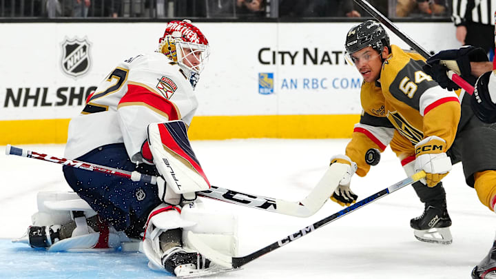Jan 4, 2024; Las Vegas, Nevada, USA; Florida Panthers goaltender Sergei Bobrovsky (72) makes a save as Vegas Golden Knights left wing Grigori Denisenko (54) looks for a rebound during the second period at T-Mobile Arena. Mandatory Credit: Stephen R. Sylvanie-Imagn Images