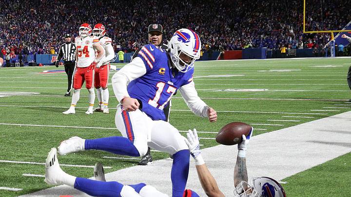 Buffalo Bills quarterback Josh Allen (17) jumps in to celebrate with Buffalo Bills wide receiver