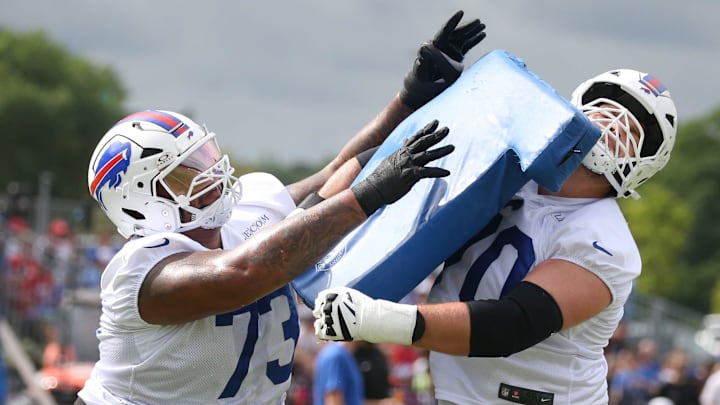 Bills offensive lineman Dion Dawkins collides with Alec Anderson during position drills during day three of Buffalo Bills training camp at St. John Fisher University Friday, July 25, 2025 in Pittsford, NY.