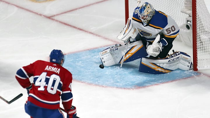 Oct 12, 2019; Montreal, Quebec, CAN; St. Louis Blues goaltender Jordan Binnington (50) makes a save against Montreal Canadiens right wing Joel Armia (40) during the second period at Bell Centre. Mandatory Credit: Jean-Yves Ahern-Imagn Images
