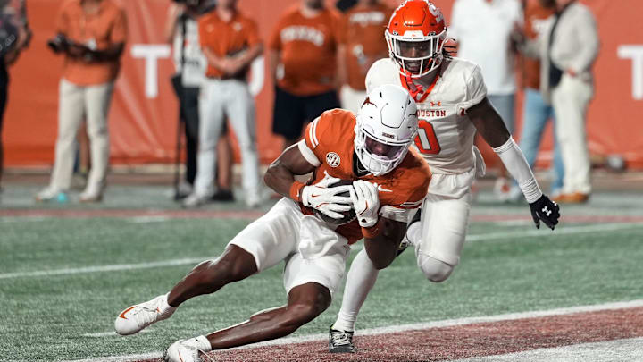 Sep 20, 2025; Austin, Texas, USA; Texas Longhorns wide receiver Ryan Wingo (1) catches a pass for a touchdown ahead of Sam Houston Bearkats defensive back Alonzo Edwards III (0) during the second half at Darrell K Royal-Texas Memorial Stadium. Mandatory Credit: Scott Wachter-Imagn Images
