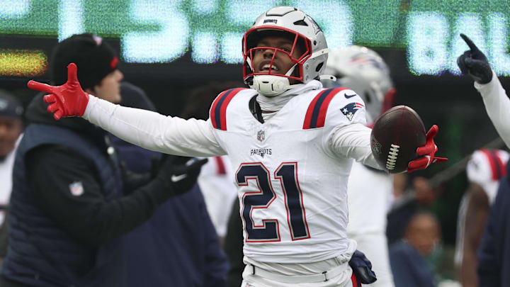 Dec 28, 2025; East Rutherford, New Jersey, USA; New England Patriots safety Jaylinn Hawkins (21) celebrates an interception against the New York Jets during the first quarter of the game at MetLife Stadium. Mandatory Credit: Vincent Carchietta-Imagn Images