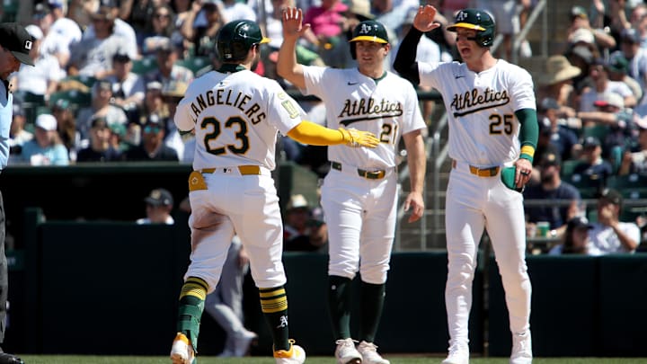 May 10, 2025; West Sacramento, California, USA; Athletics designated hitter Shea Langeliers (23) celebrates with Tyler Soderstrom (21) and Jacob Wilson (5) after hitting a three run home run against the New York Yankees during the seventh inning at Sutter Health Park. Mandatory Credit: Dennis Lee-Imagn Images
