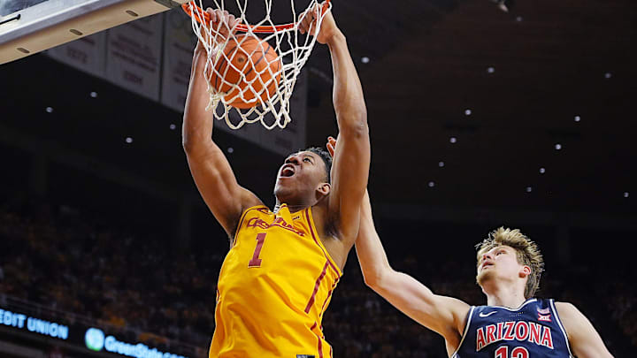 Iowa State Cyclones center Dishon Jackson (1) dunks the ball over Arizona Wildcats forward Henri Veesaar (13) during the first half in the Big 12 men’s basketball showdown at Hilton Coliseum on Saturday March 1, 2025 in Ames, Iowa.