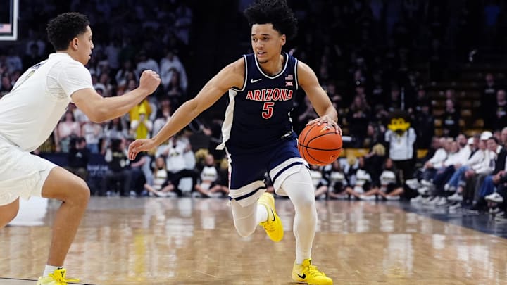 Mar 7, 2026; Boulder, Colorado, USA; Arizona Wildcats guard Brayden Burries (5) controls the ball in the first half against the Colorado Buffaloes at the CU Events Center. Mandatory Credit: Ron Chenoy-Imagn Images